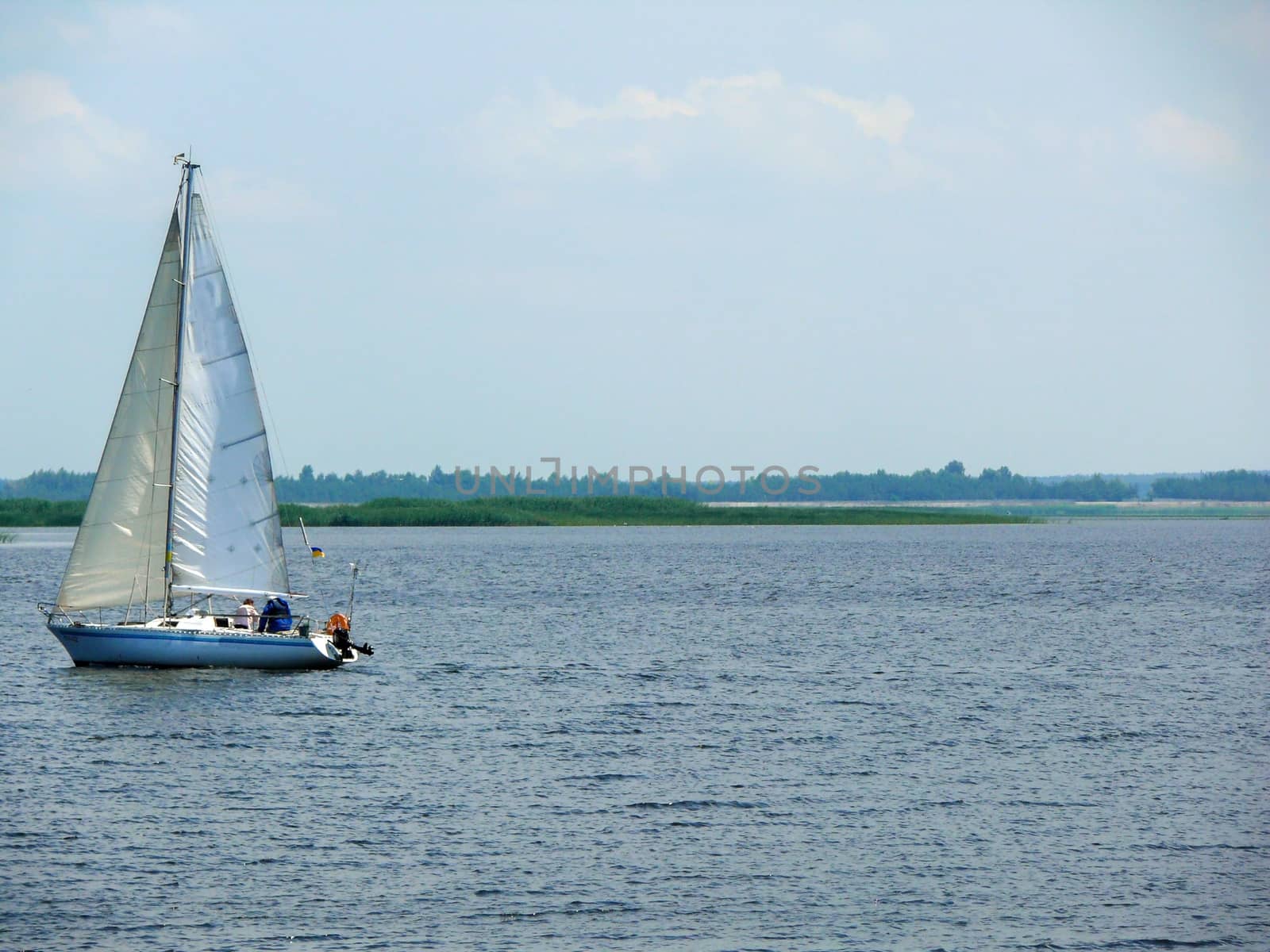 a Sailingboat on a lake at sunny day, Ukraine