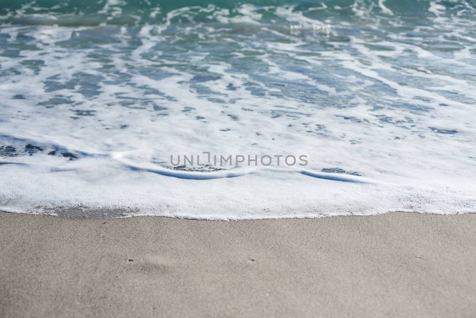 Soft wave of Black sea on sandy beach. Nature Background