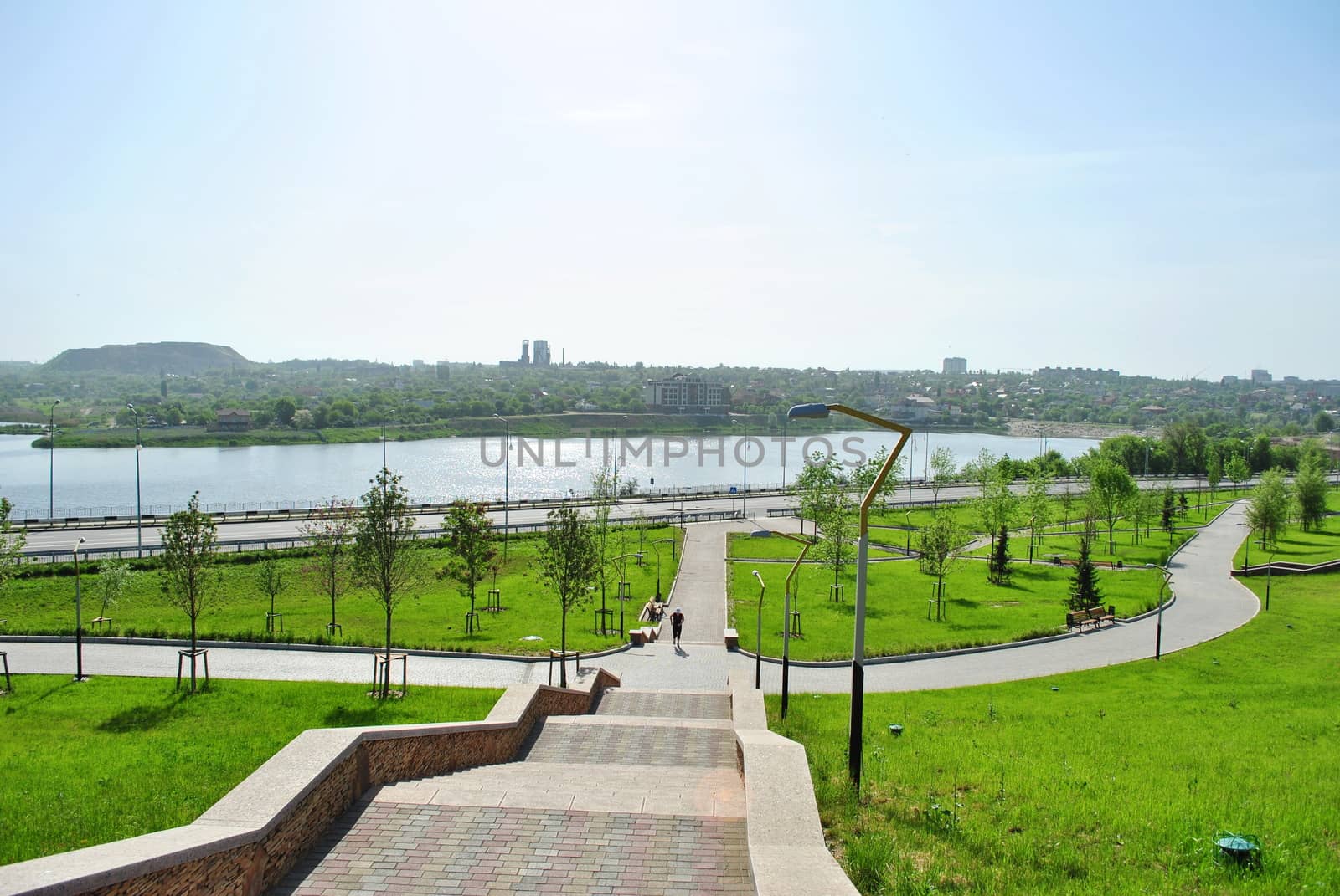 Panorama of the park in the center of Donetsk and the man on a run in it