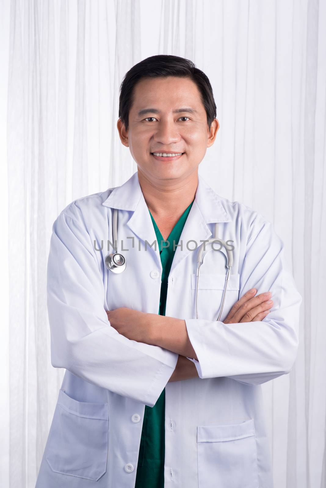 Male Doctor with stethoscope in a hospital