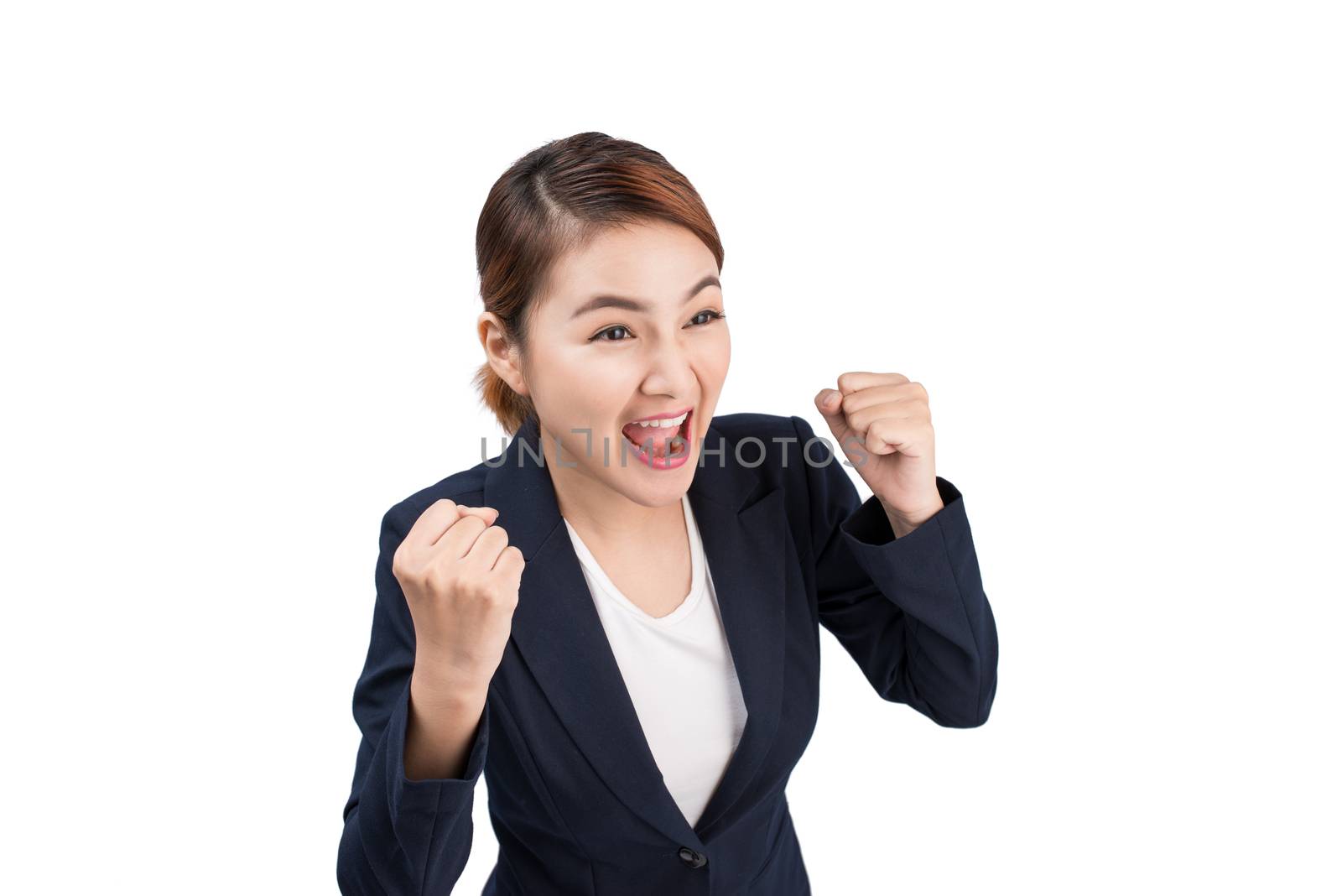 Close-up of an excited businesswoman celebrating with arms up by makidotvn