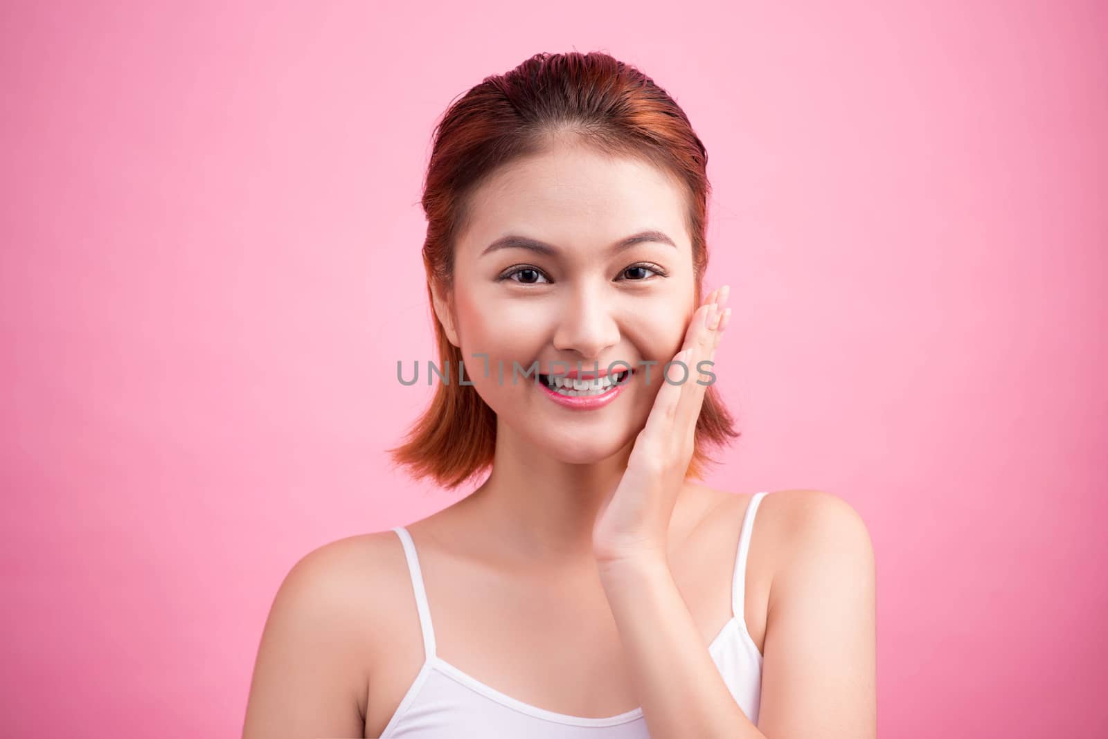 Portrait of a beautiful smiling young woman with natural make-up by makidotvn