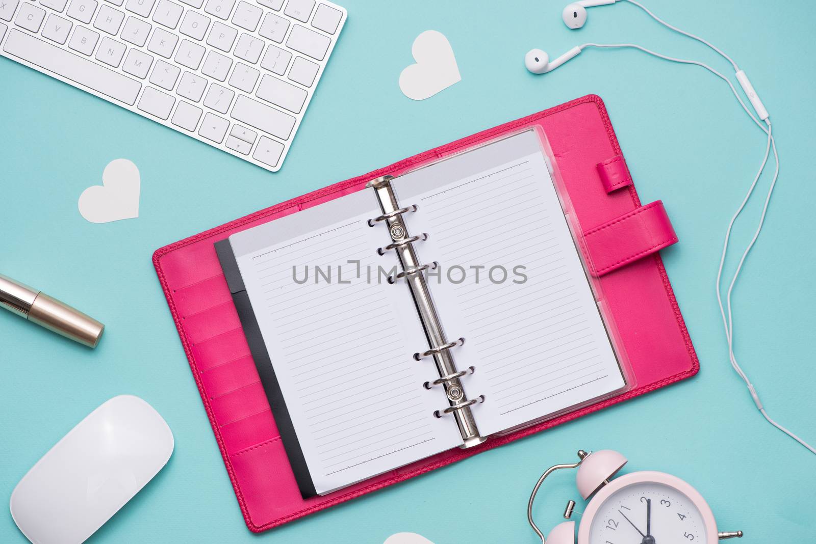 Mother's Day concept. Pink roses with gift box on woman office desk. Open notebook for copy space.