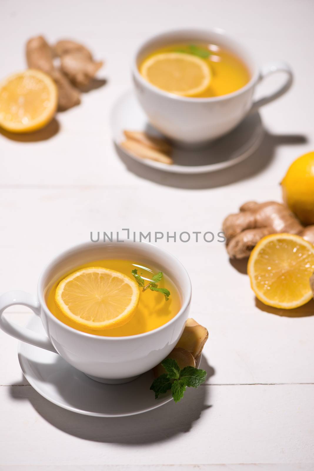 Healthy ginger tea ingredients on a wooden table by makidotvn