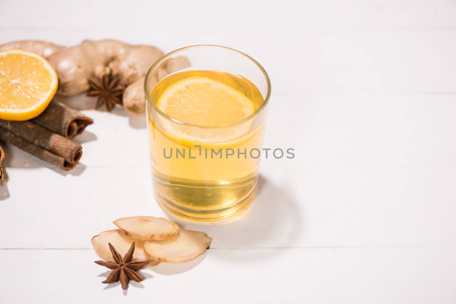 Healthy ginger tea ingredients on a wooden table