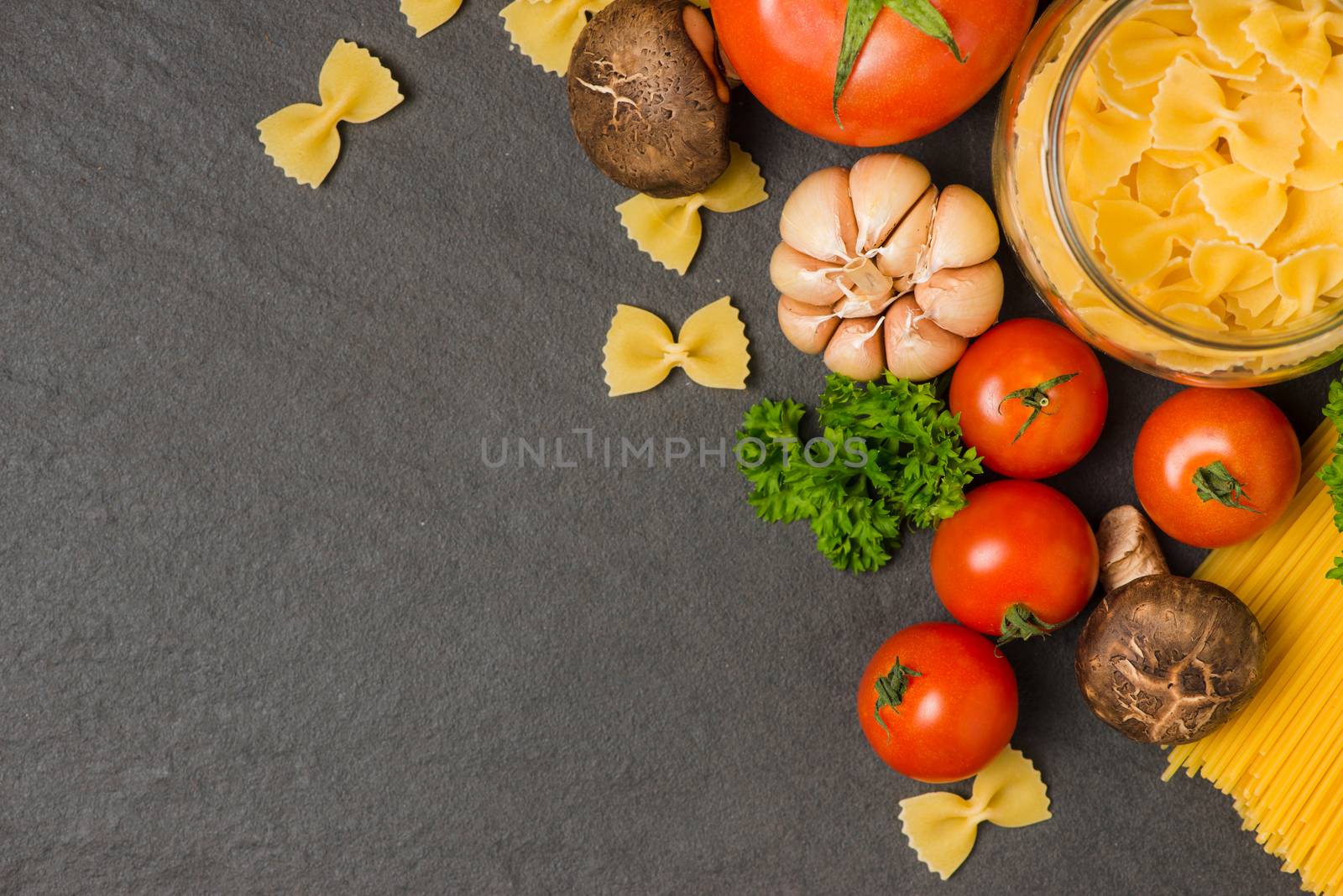 Italian food concept. Pasta ingredients. Cherry-tomatoes, spaghe by makidotvn