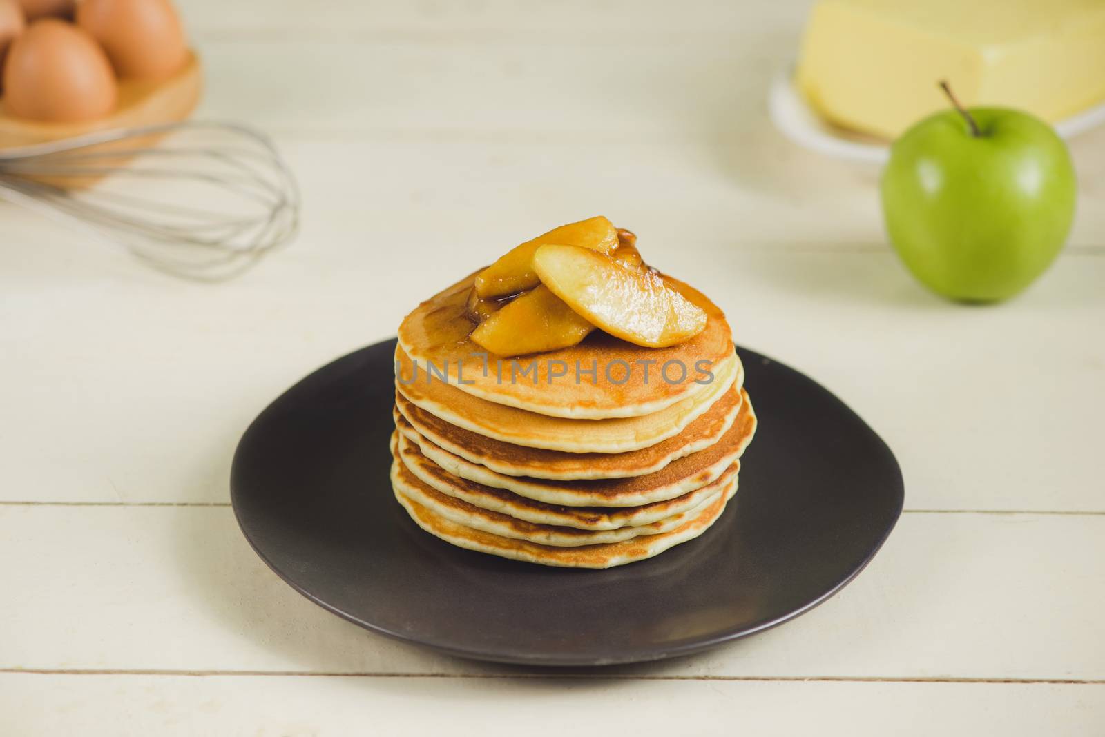 Pancakes with apple on table. Breakfast, snacks. Pancakes Day. by makidotvn