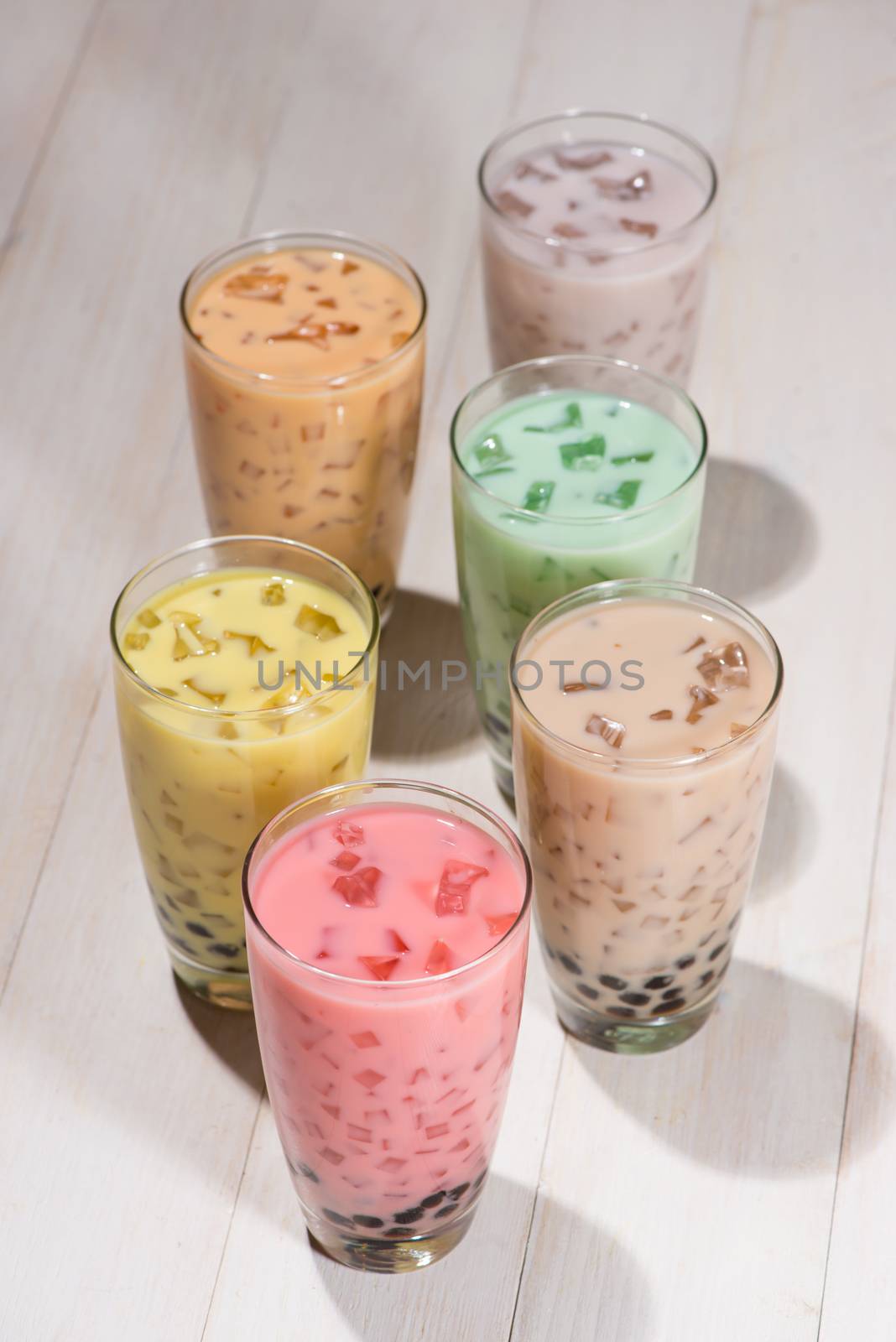 Bubble tea. Homemade Various Milk Tea with Pearls on wooden tabl by makidotvn