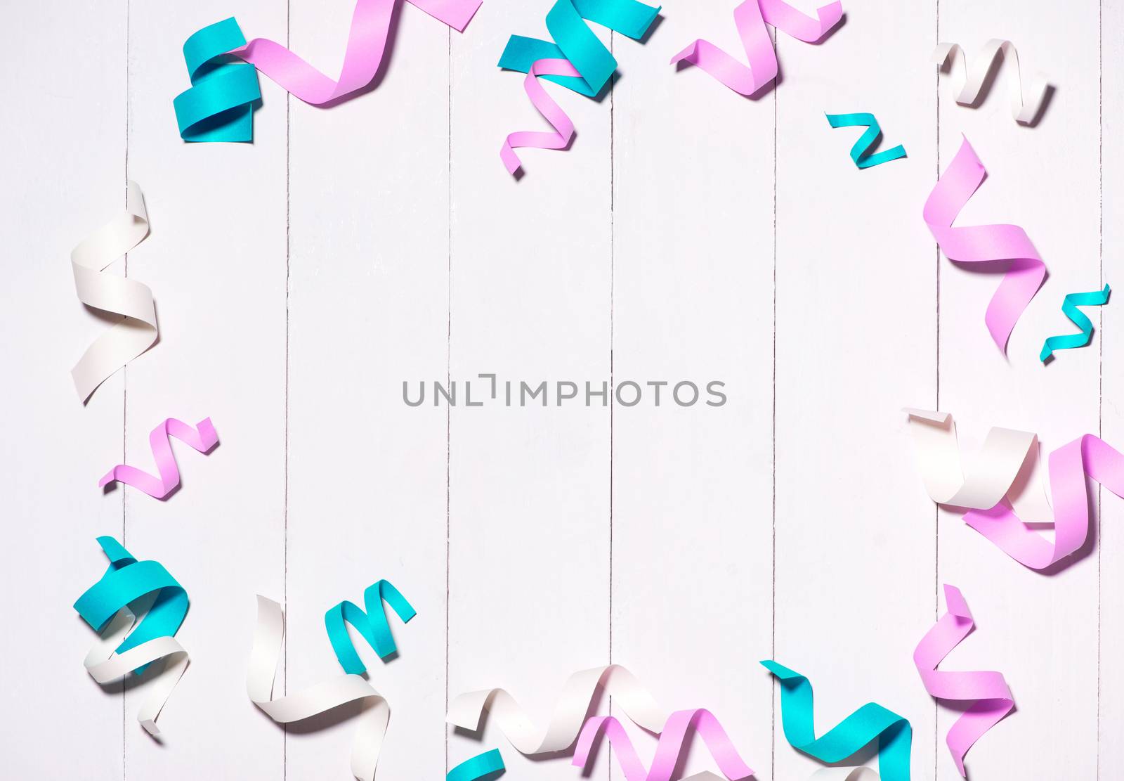 Celebration Flat lay with colorful party items on wooden background.
