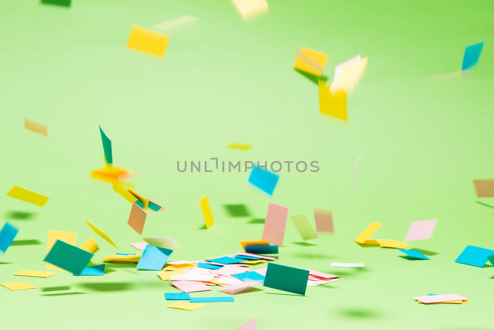Celebration Flat lay with colorful party items on green background.