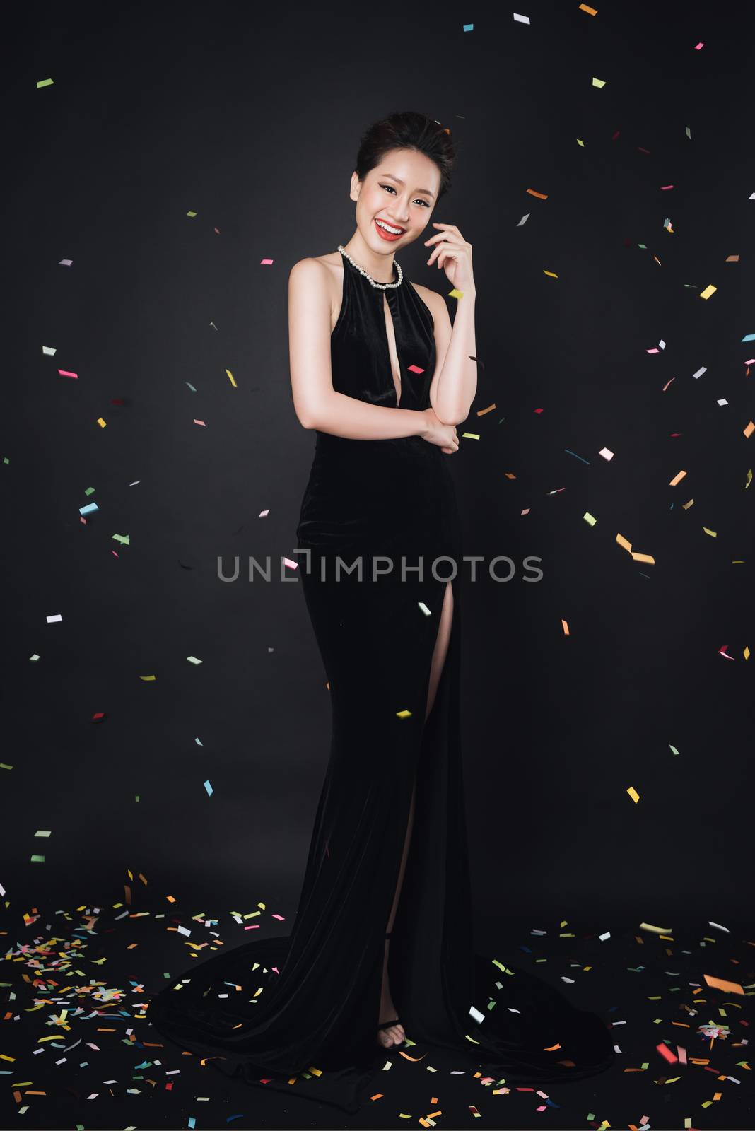 Asian woman with fashion makeup in luxury black dress while conf by makidotvn