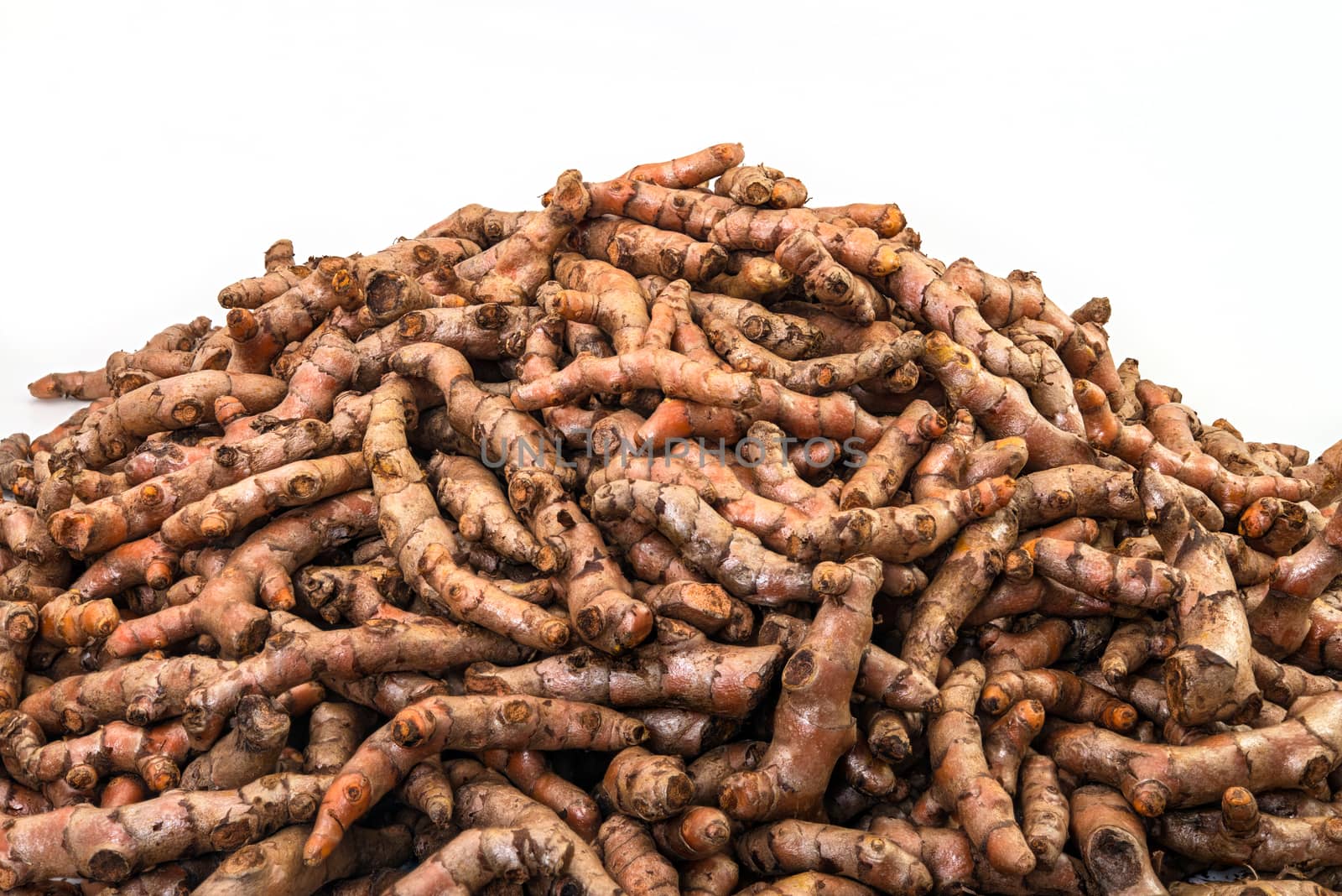 Fresh turmeric roots display in the fresh vegetable market