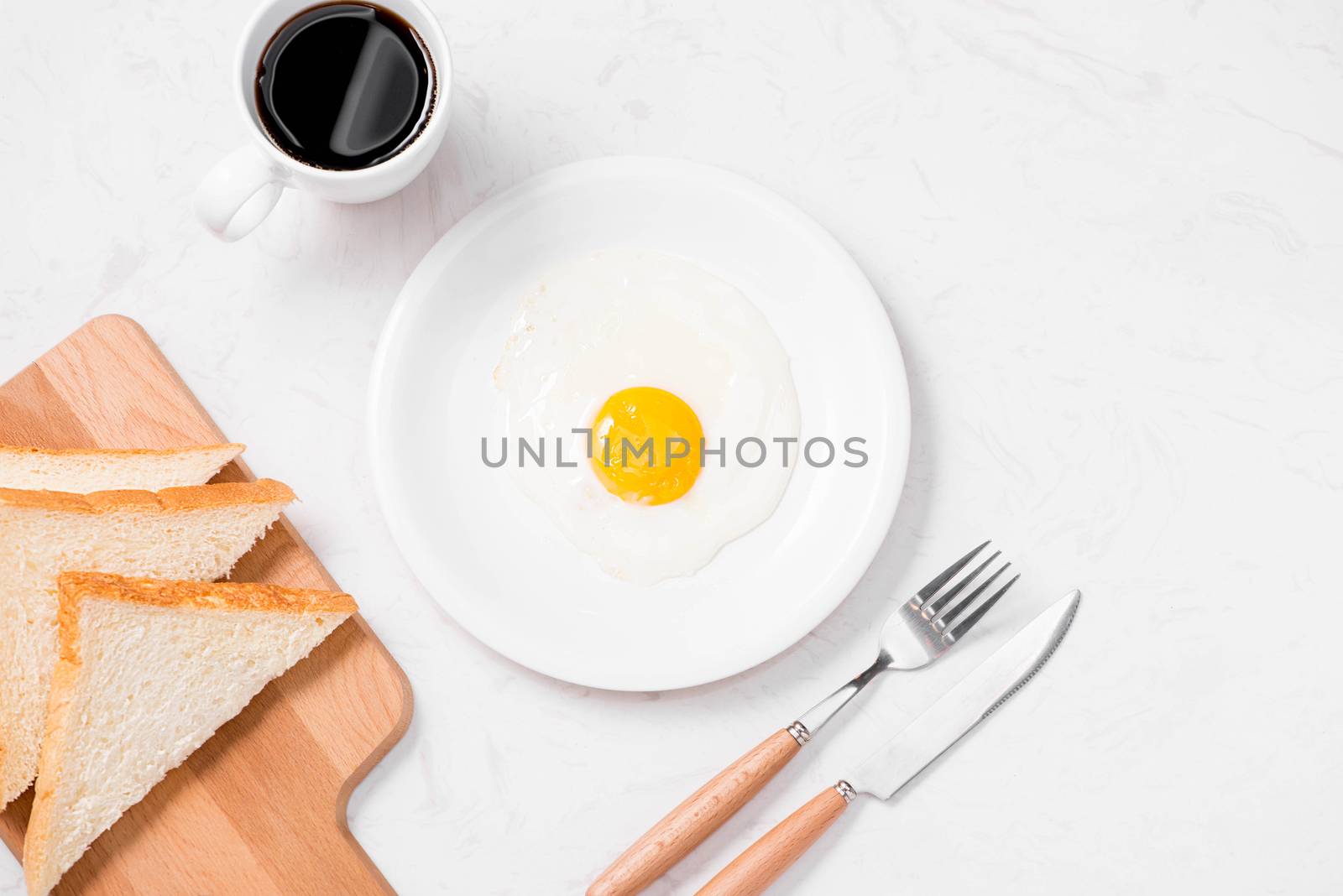 Traditional breakfast with fried eggs on a plate by makidotvn