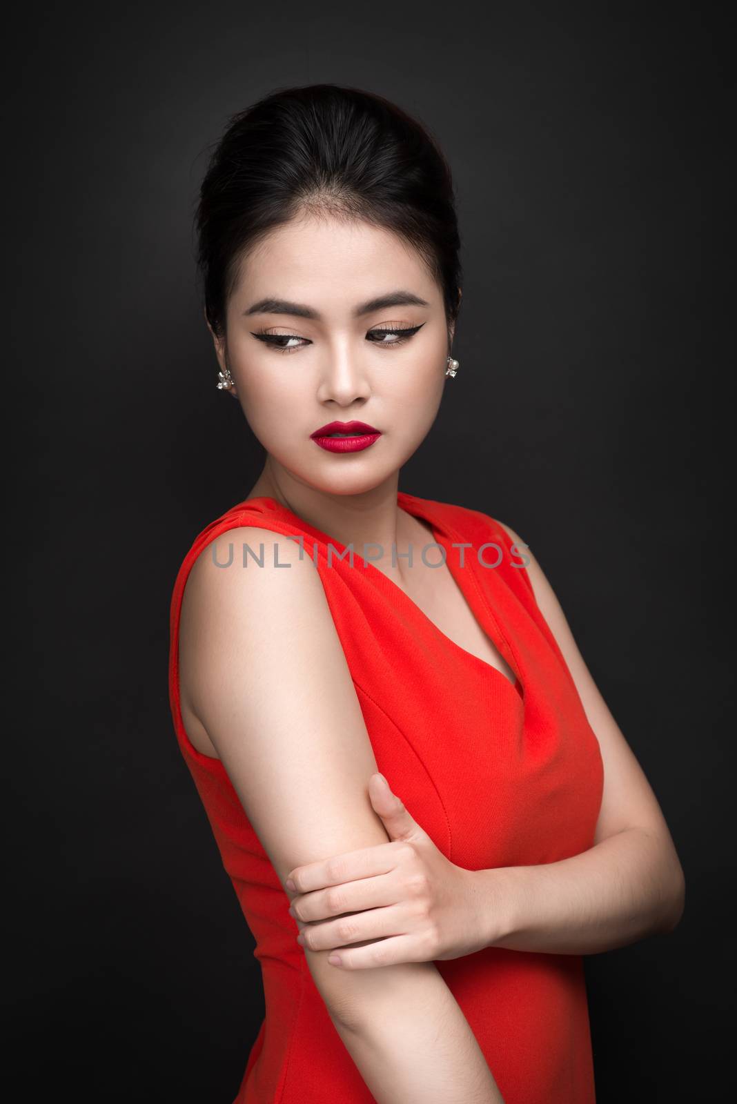 Closeup of beautiful sexy girl with bright makeup and red lips. Beauty fashion asian woman.