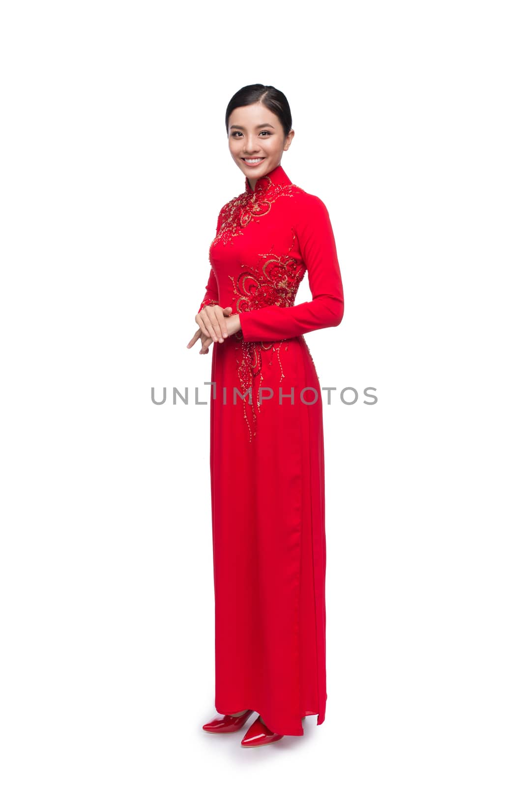 Full body of charming Vietnamese Woman in Ao Dai Traditional Dress isolated on white.