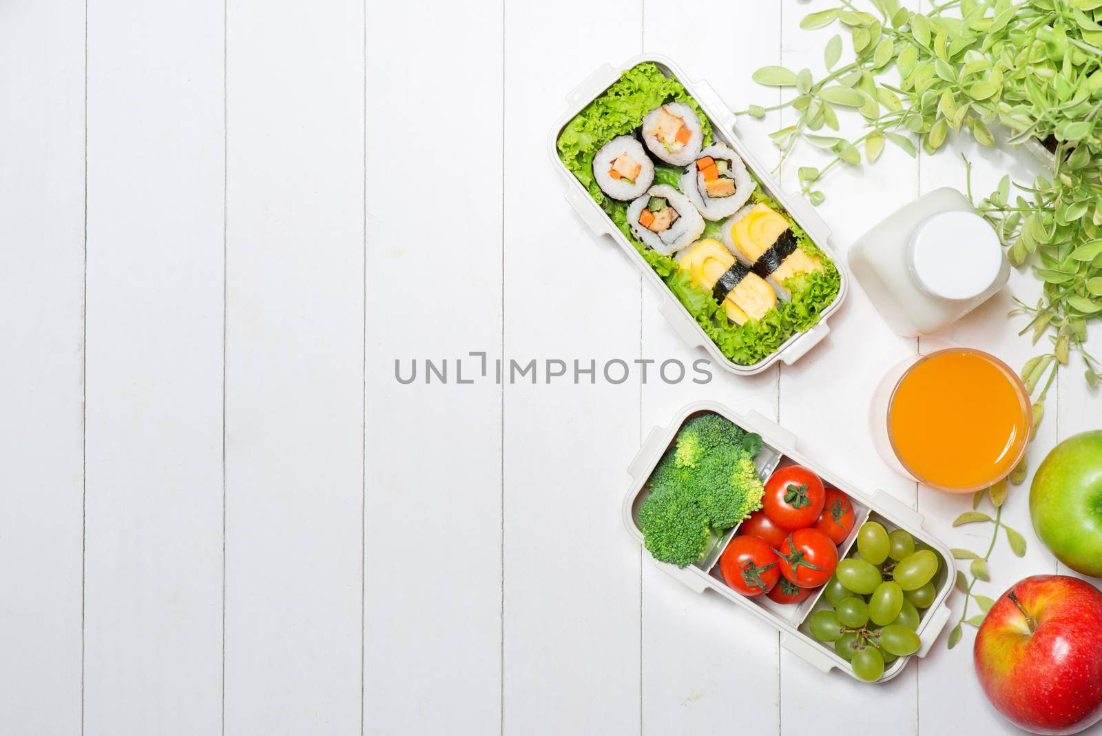 Bento box with different food, fresh veggies and fruits by makidotvn