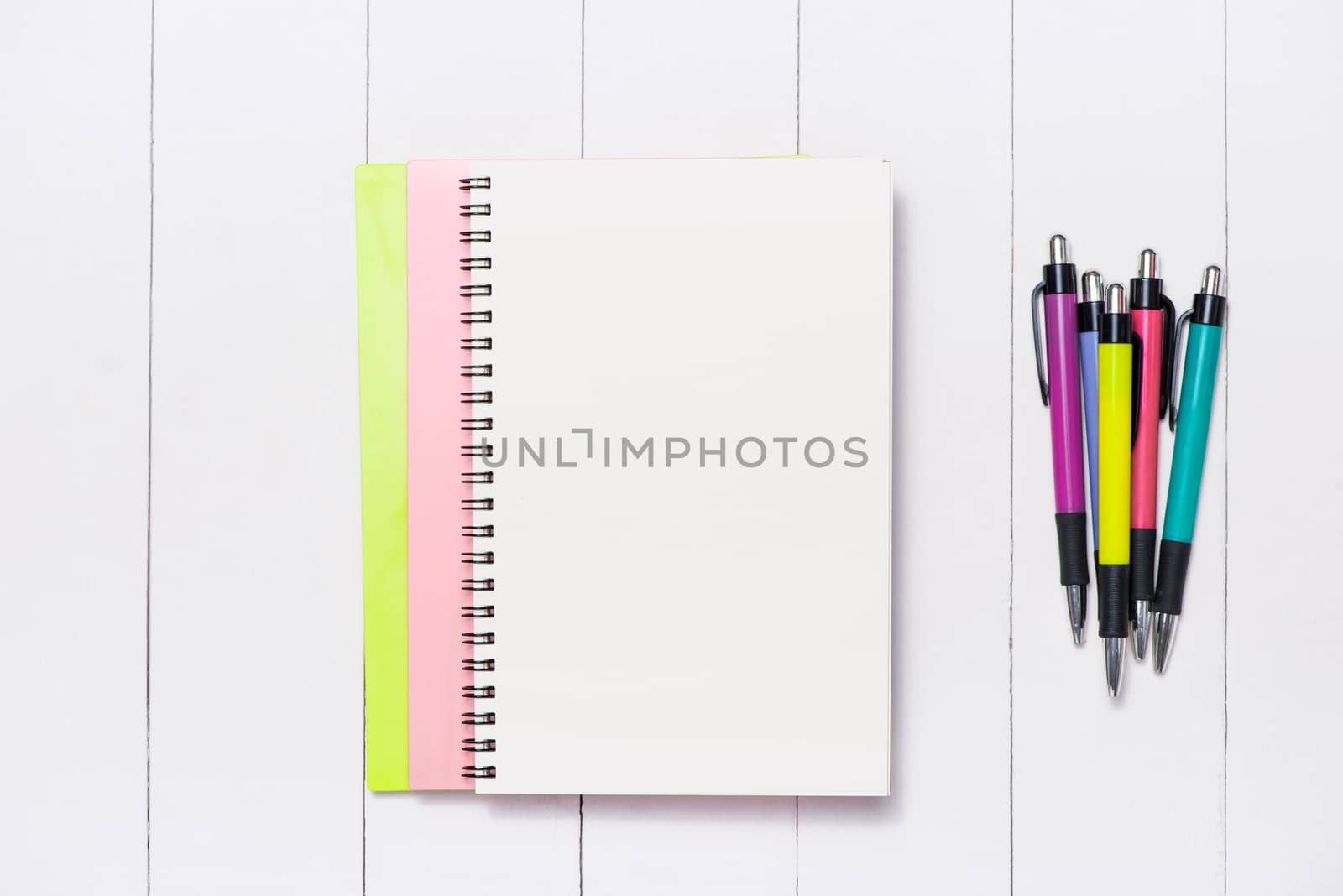 School stationery or office supplies on wood background.