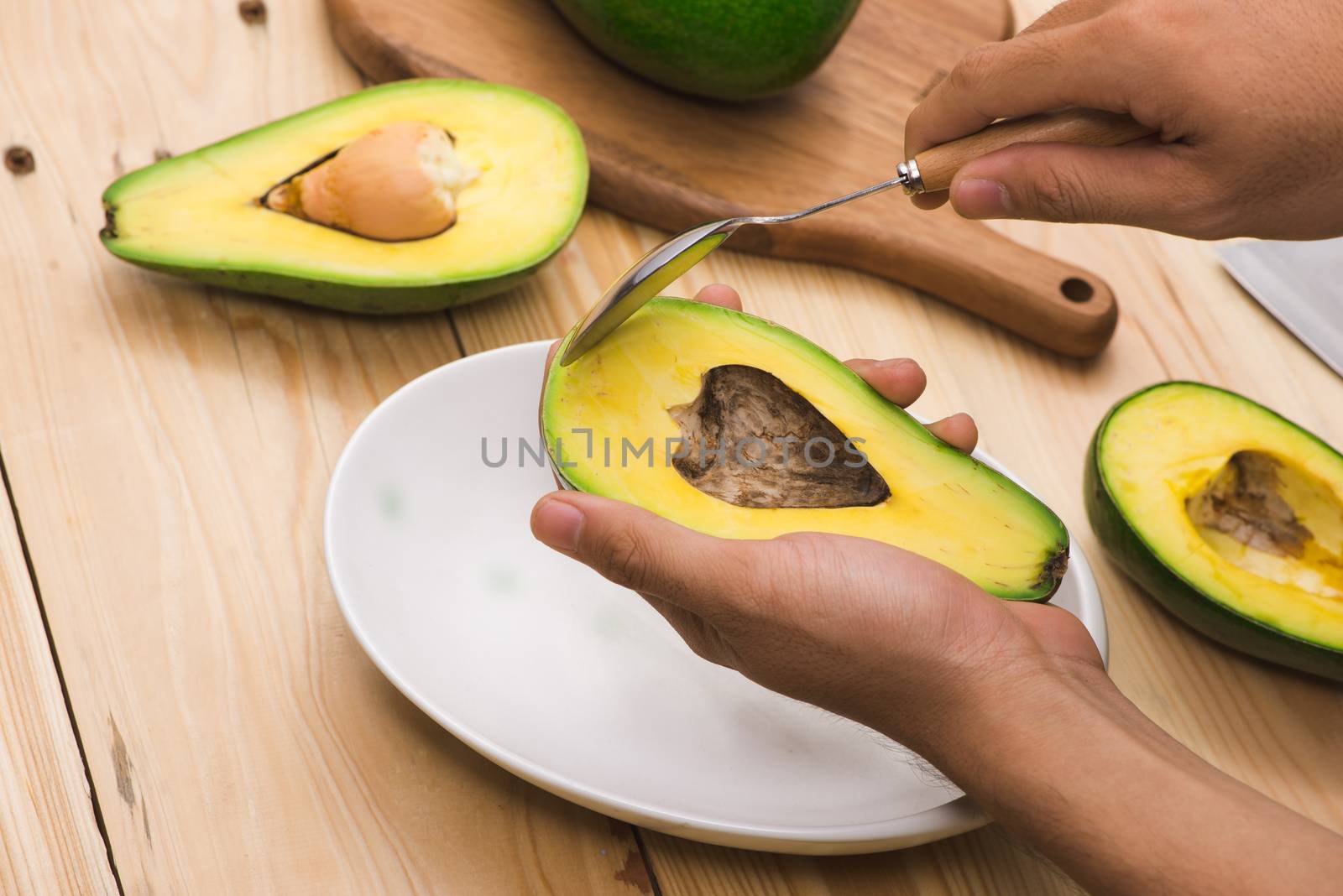 Healthy food concept. Eating fresh organic avocado