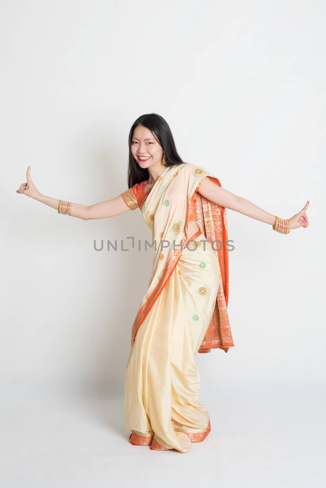 Female in Indian sari dress dancing by szefei