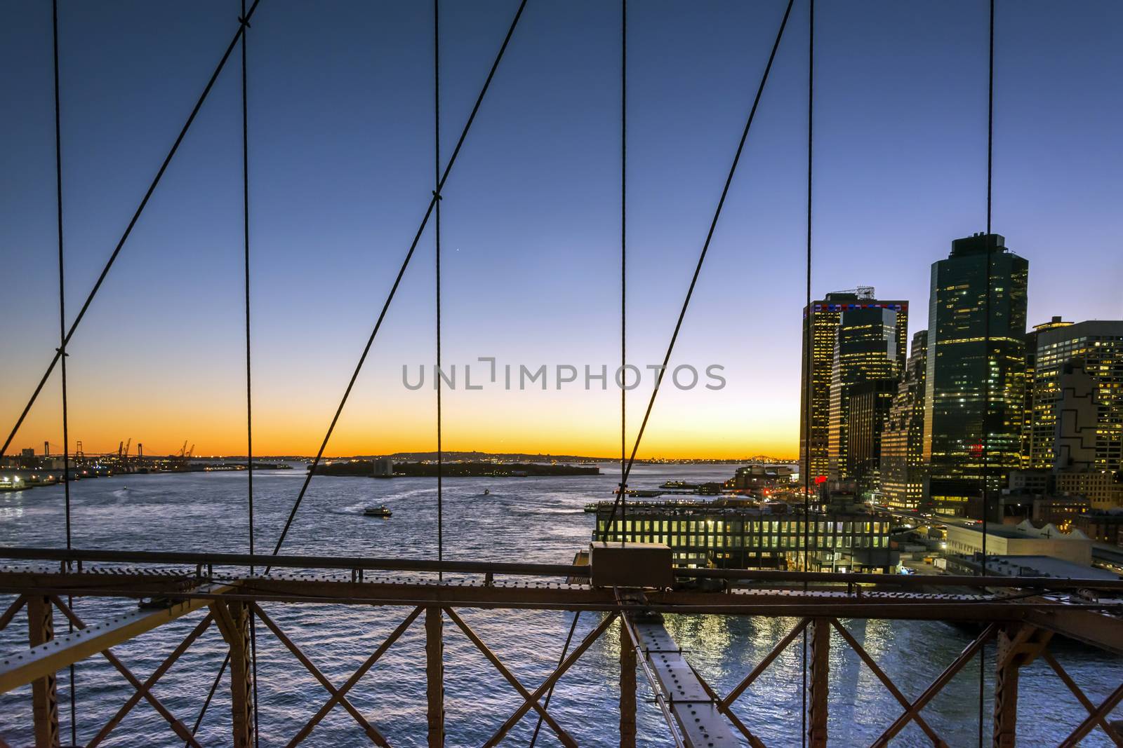 New York at sunset viewed from Brooklyn bridge