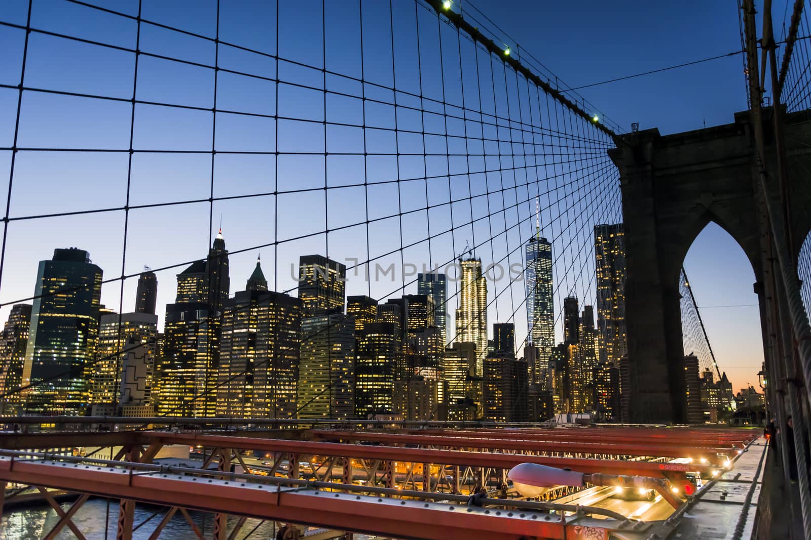 New York skyline from Brooklyn bridge at sunset