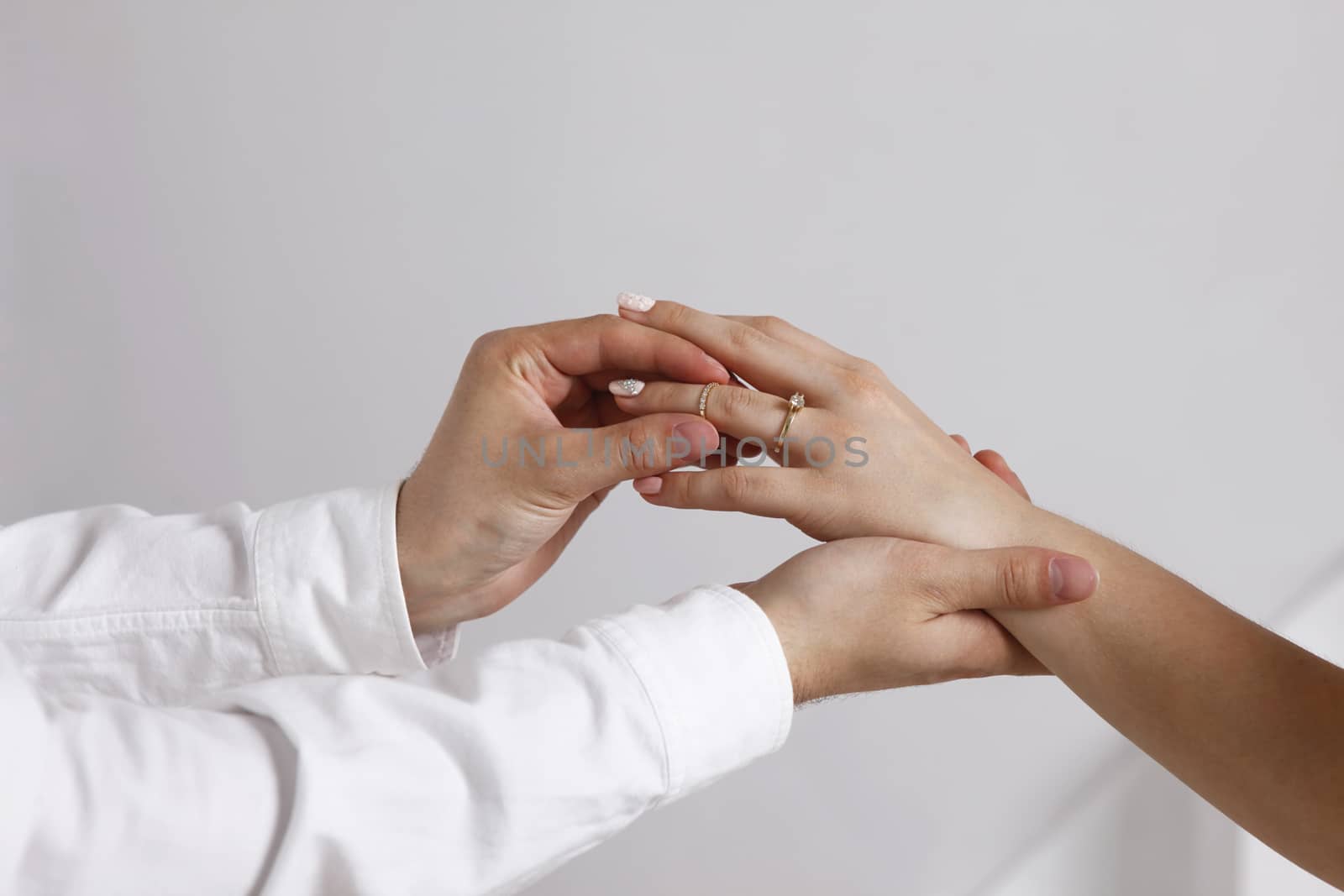 Bride wears a wedding ring to the groom