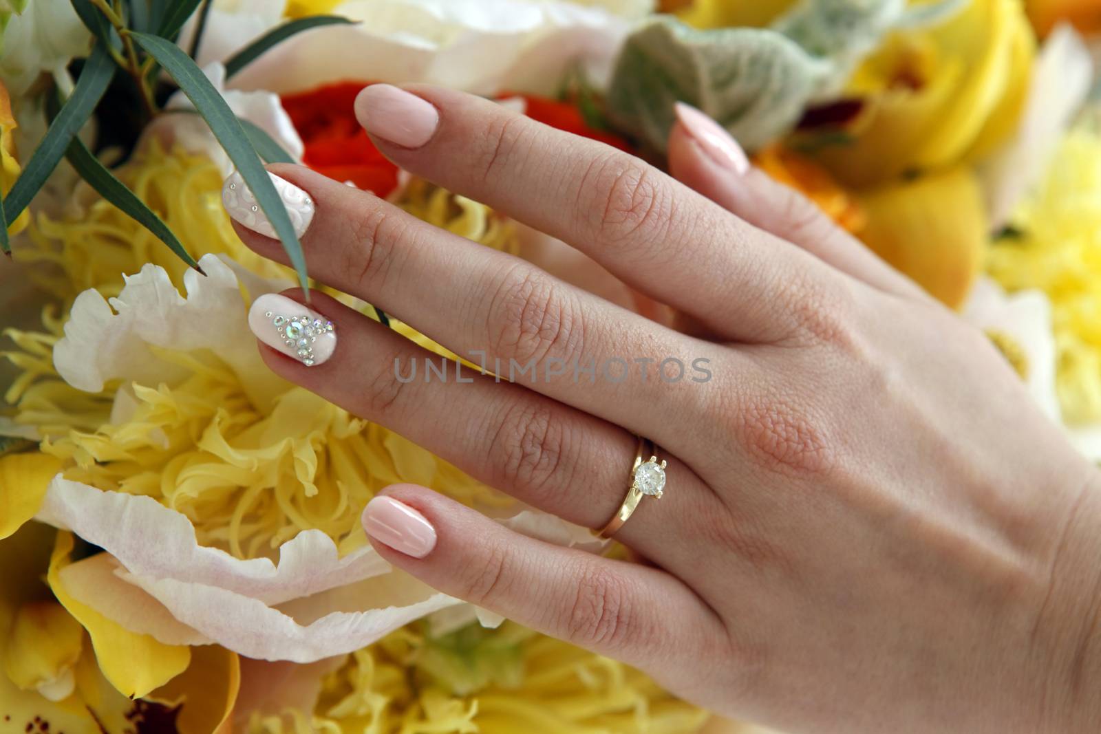 Hands of the bride with a ring 