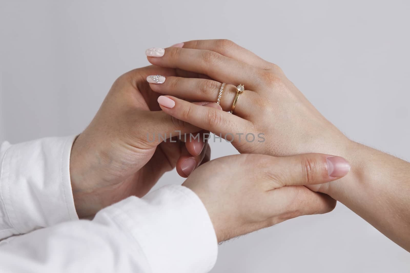 Bride wears a wedding ring to the groom