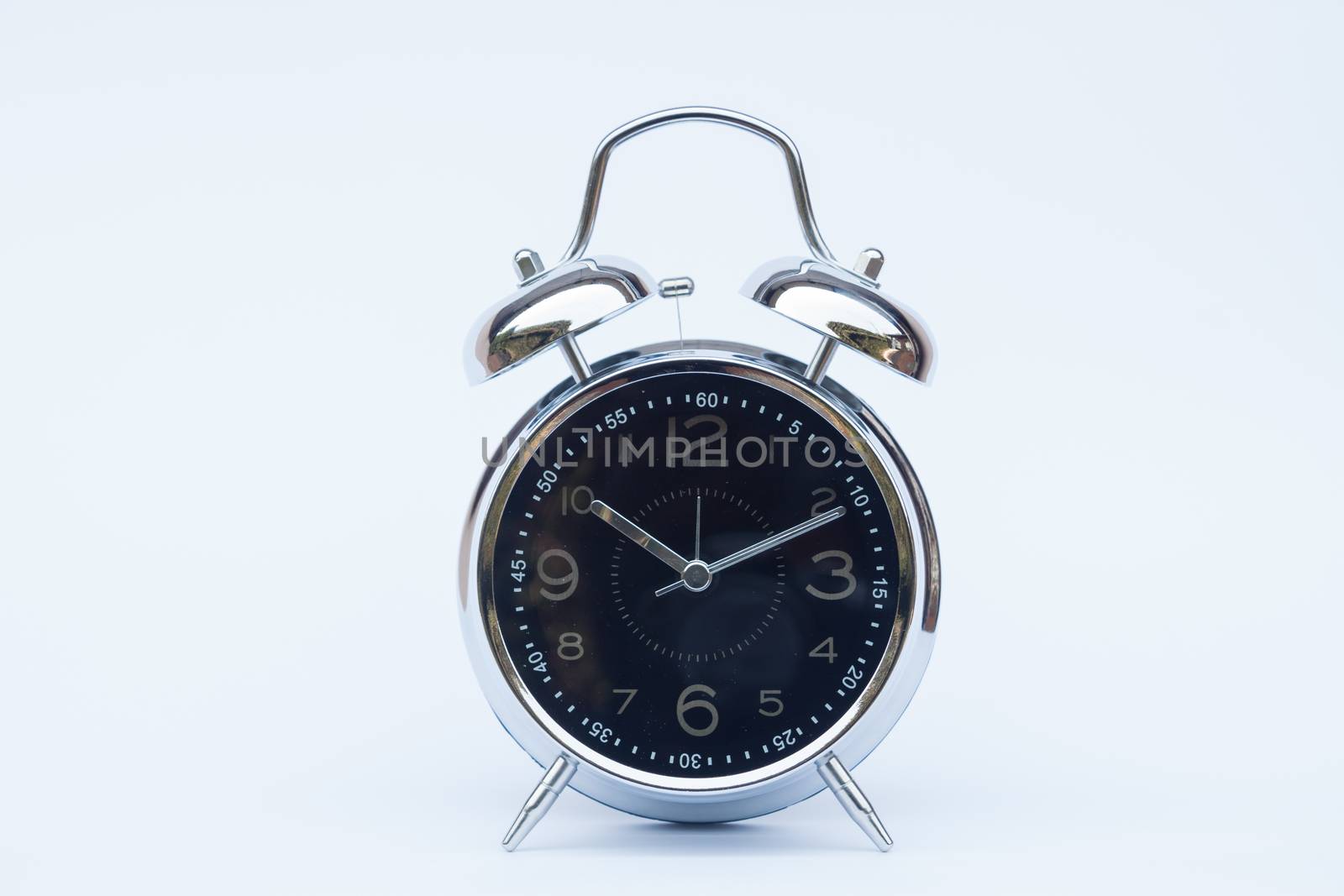 Alarm clock isolated on white background, stock photo