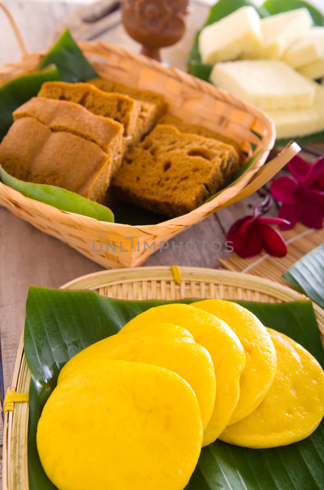 Ma Lai Gou-Traditional malaysia steamed cake. Steam chinese cake on bamboo plate. Chinese egg cake on banana leaf.