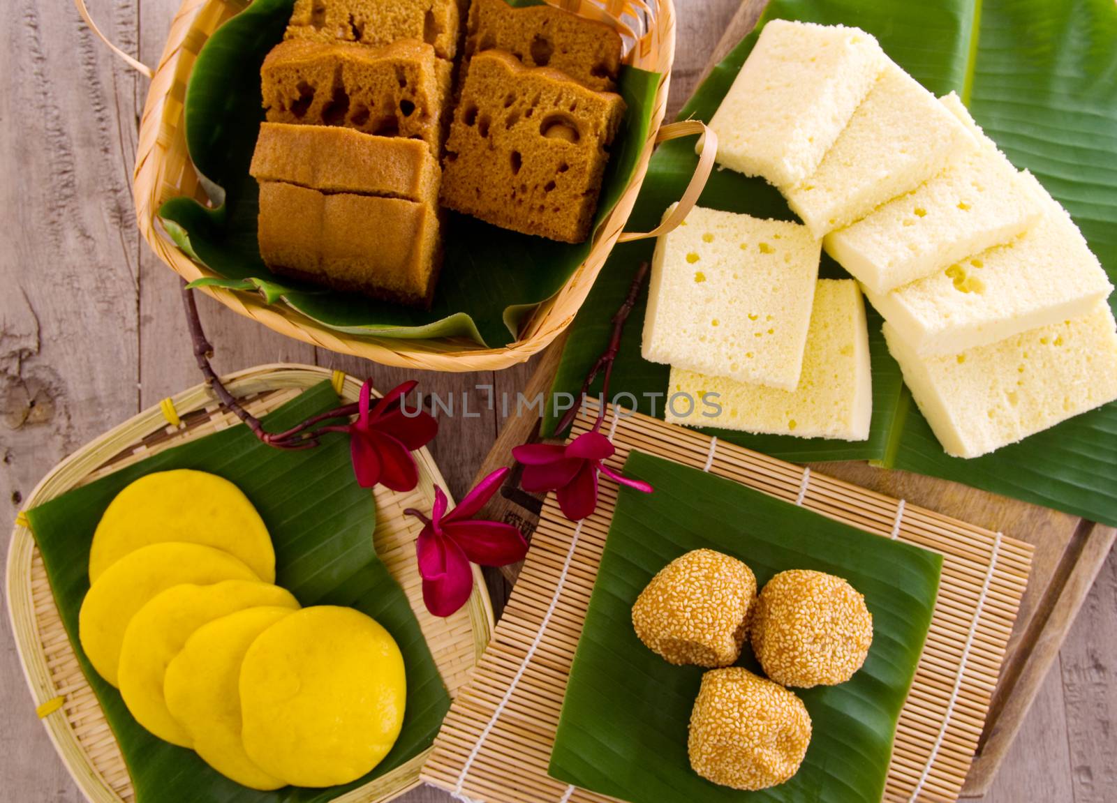 Ma Lai Gou-Traditional malaysia steamed cake.Malaysia desert ,Onde-Onde or known as Chinese Sesame Ball on banana leaf. Steam chinese cake on bamboo plate. Chinese egg cake on banana leaf.