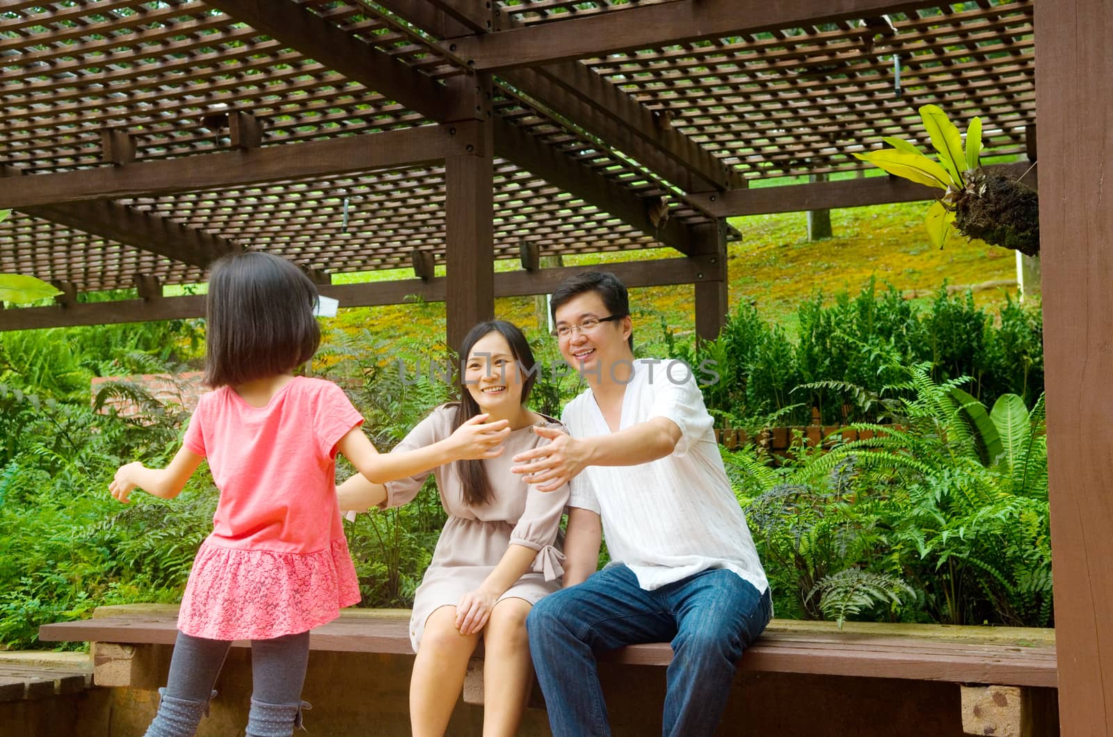 Happy Asian Family enjoying their time in the park