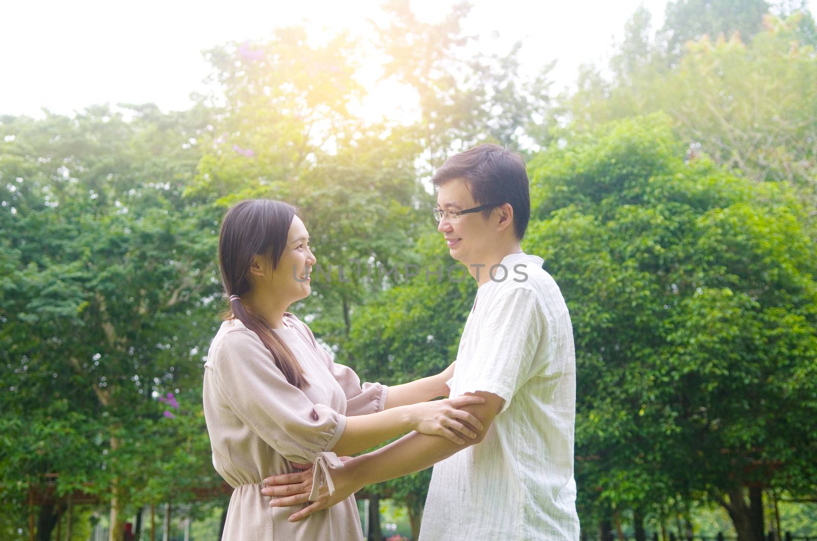 Asian romance couple in love at outdoor park.