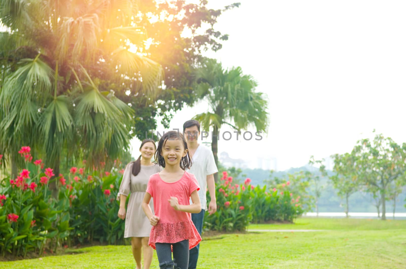 Happy Asian Family enjoying their time in the park