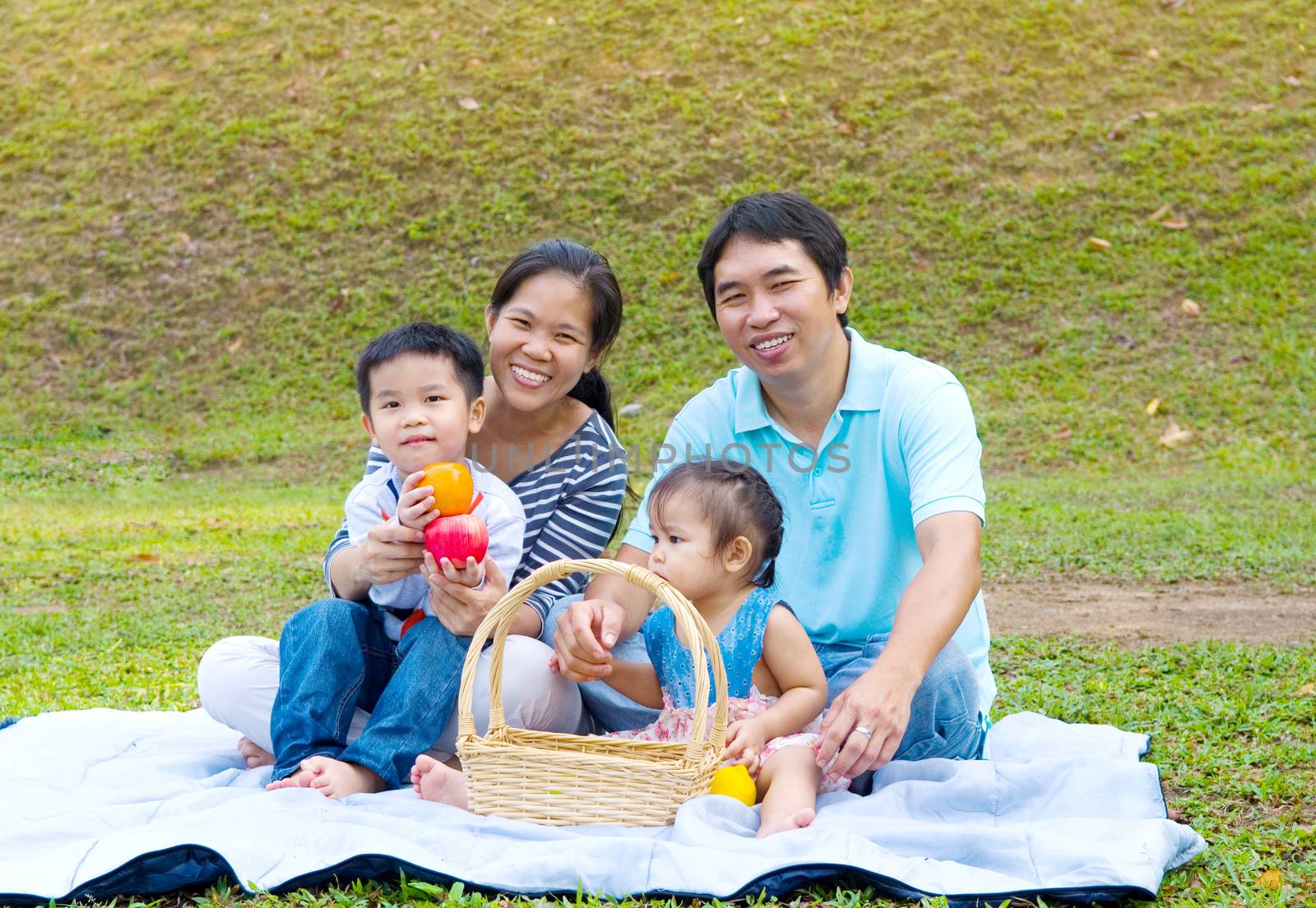 Outdoor portrait of asian family