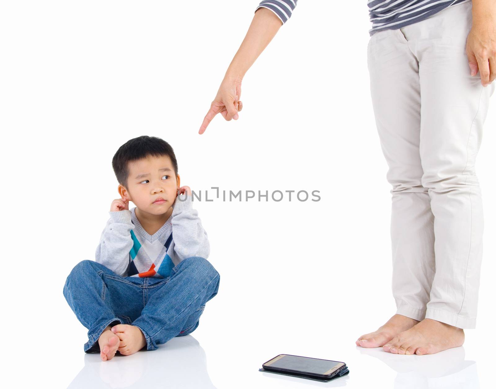 Education of the child. mother scolds her child boy playing game on smartphone. family relationships