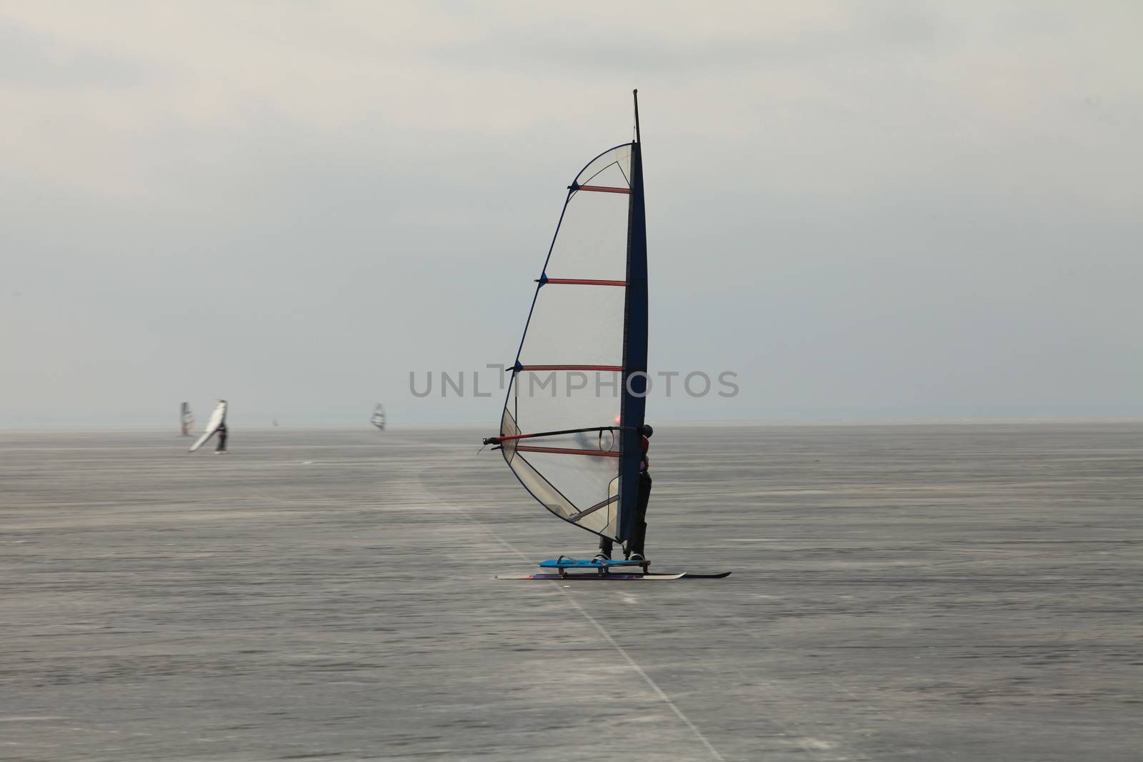 windsurfer Ice surfing  Extreme winter sport Finnish Gulf near St. Petersburg