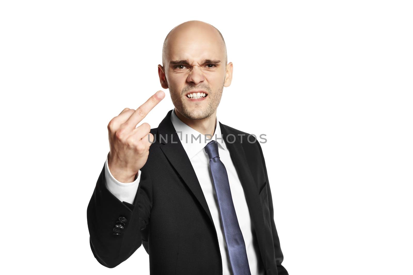 Portrait of young man shows fuck. Studio shot. Isolated on white background. 