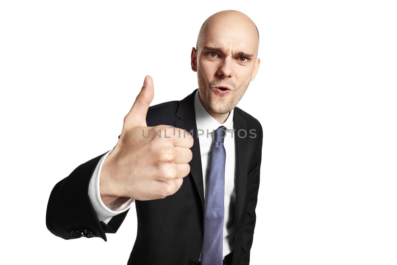 Everything went great. Portrait of happy young businessman shows his thumb. Isolated on white background.