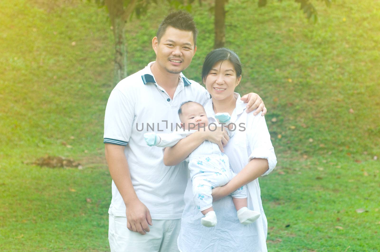 happy asian young family spending time outdoor on a summer day