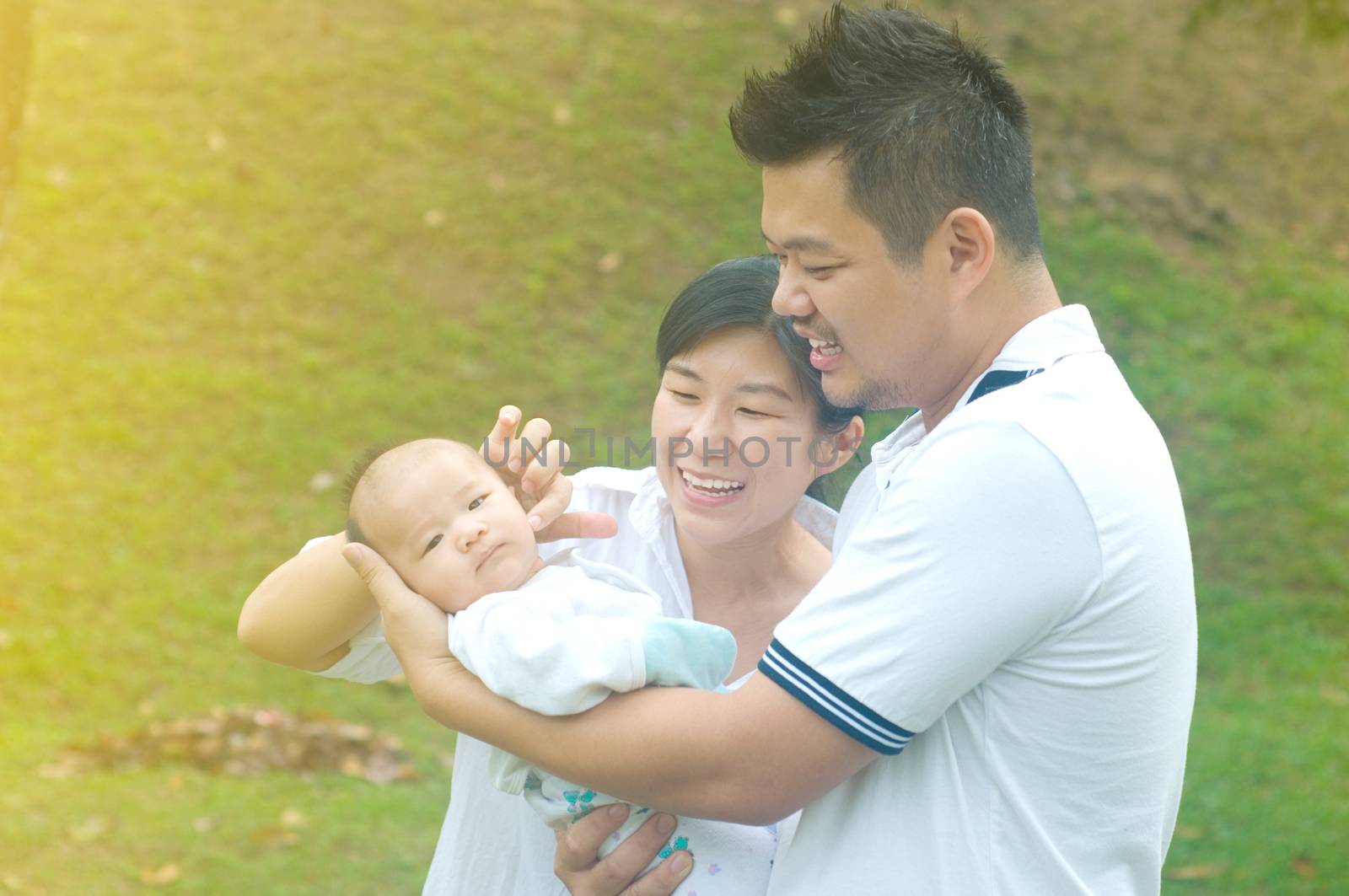 happy asian young family spending time outdoor on a summer day