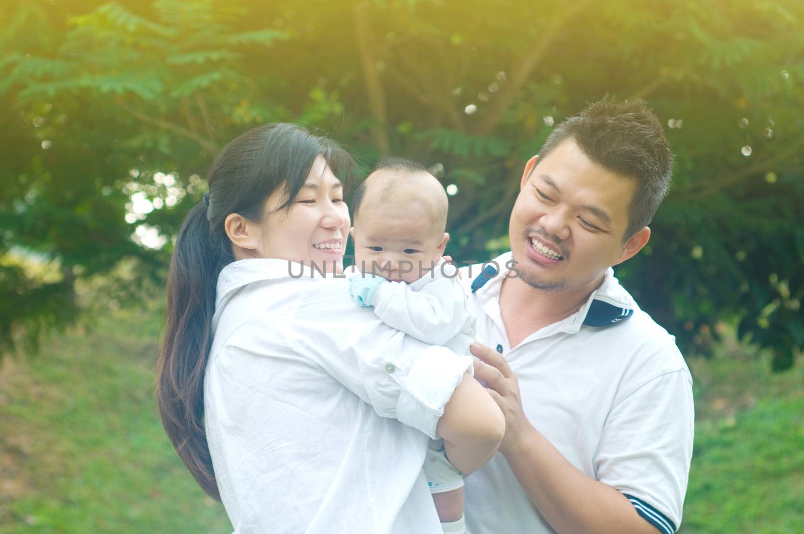 happy asian young family spending time outdoor on a summer day