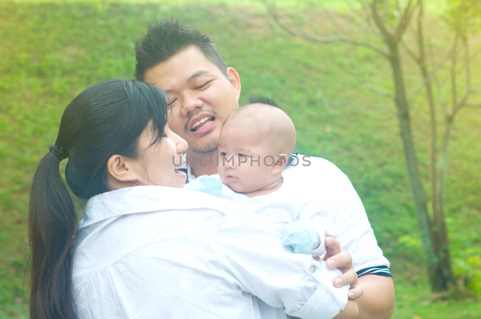 utdoor portrait of happy asian family