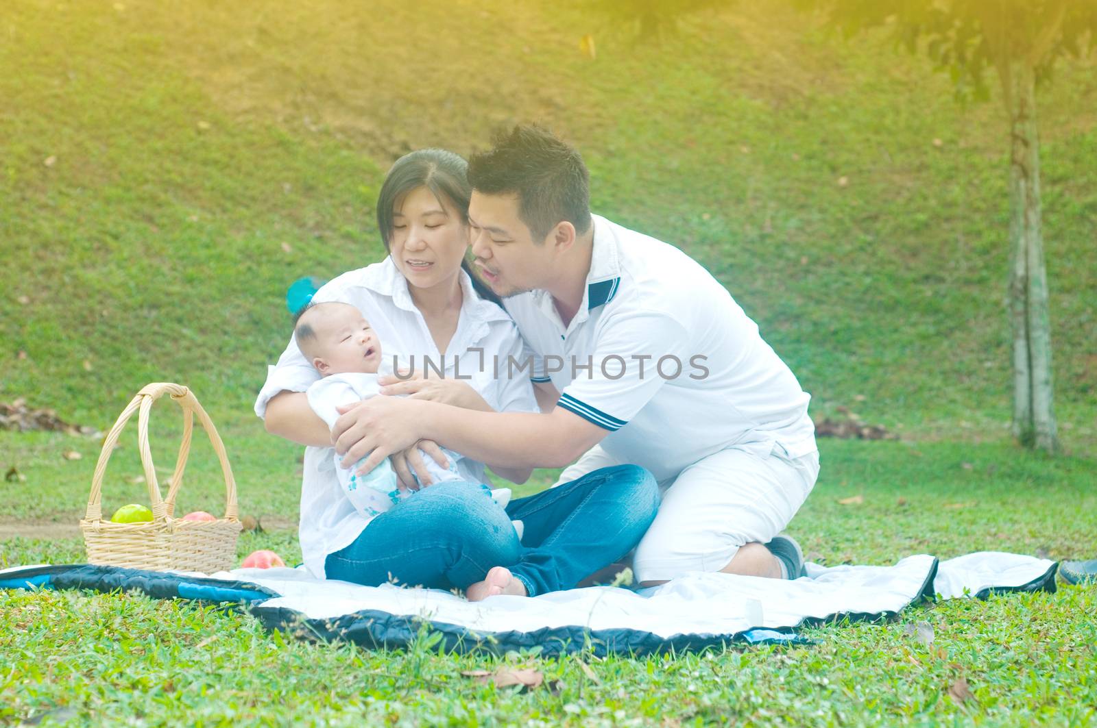 happy asian young family spending time outdoor on a summer day