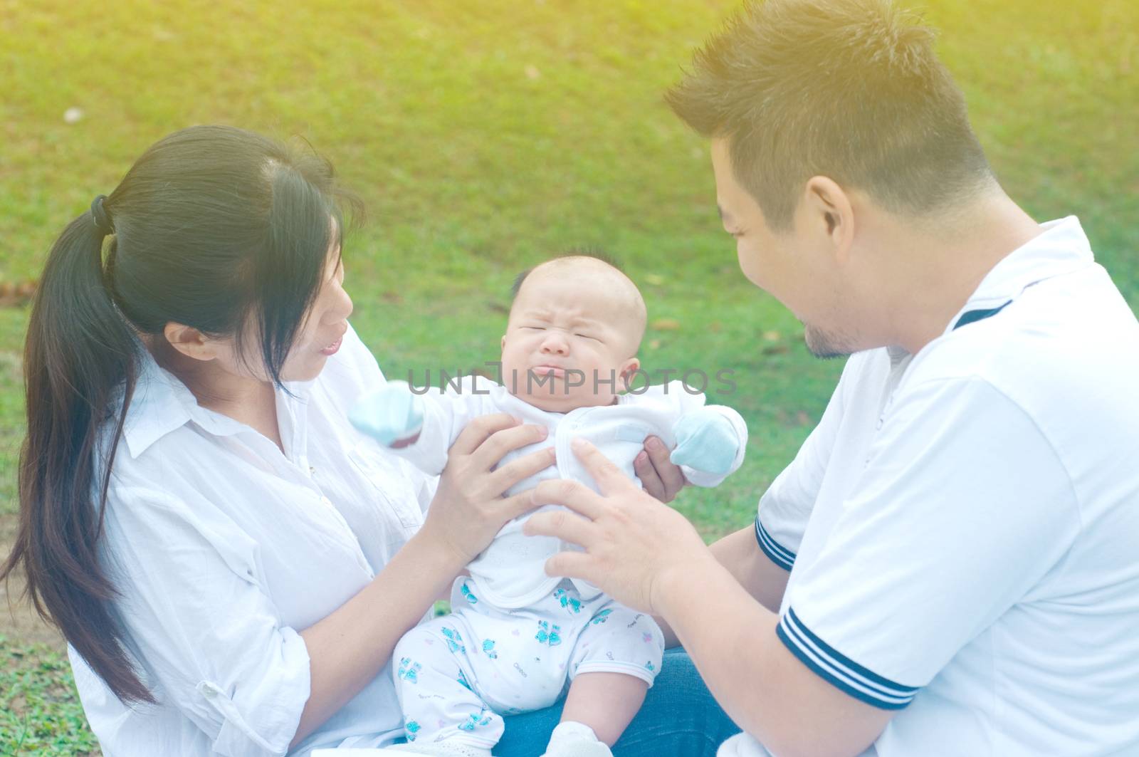 happy asian young family spending time outdoor on a summer day