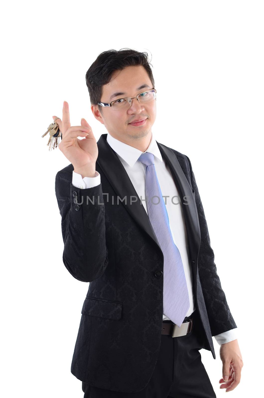 Mature adult Asian Chinese business man holding a new key over white background