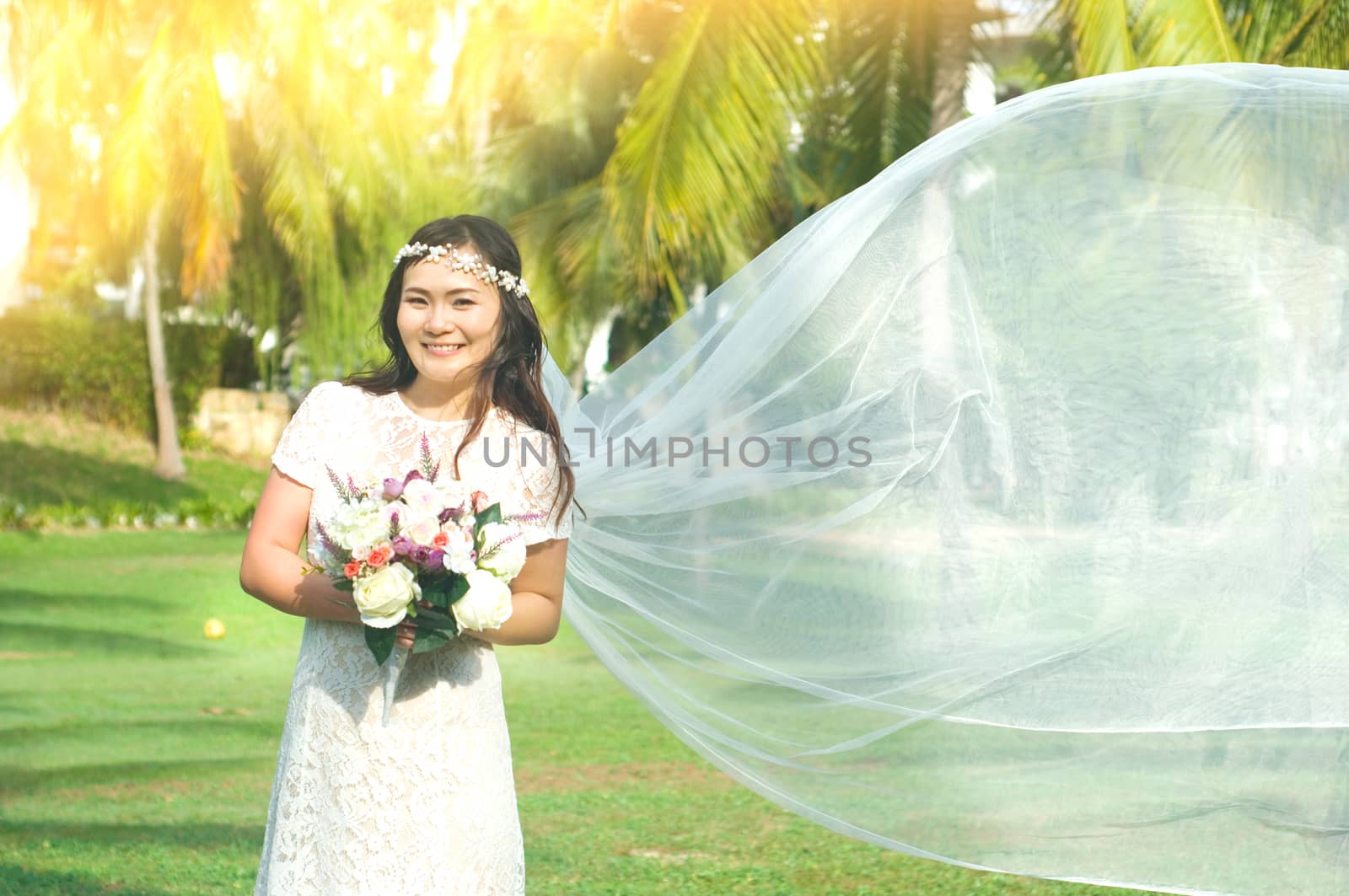 Outdoor portrait of a beautiful asian bride