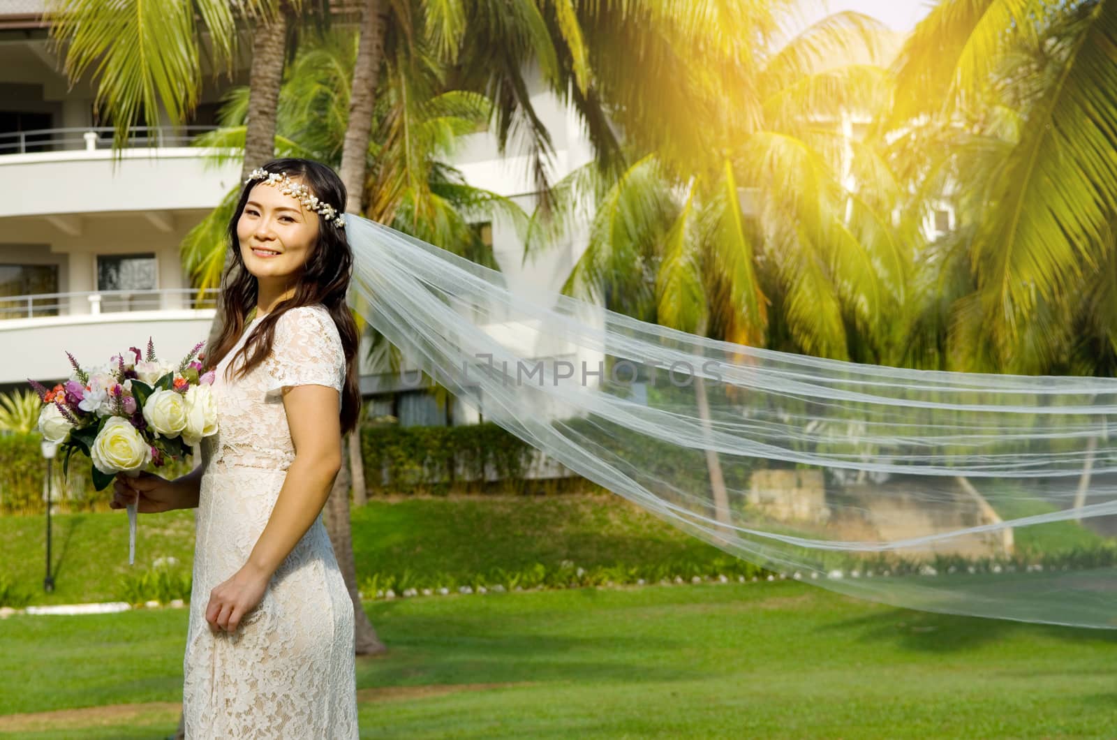 Asian bride at outdoor in a morning