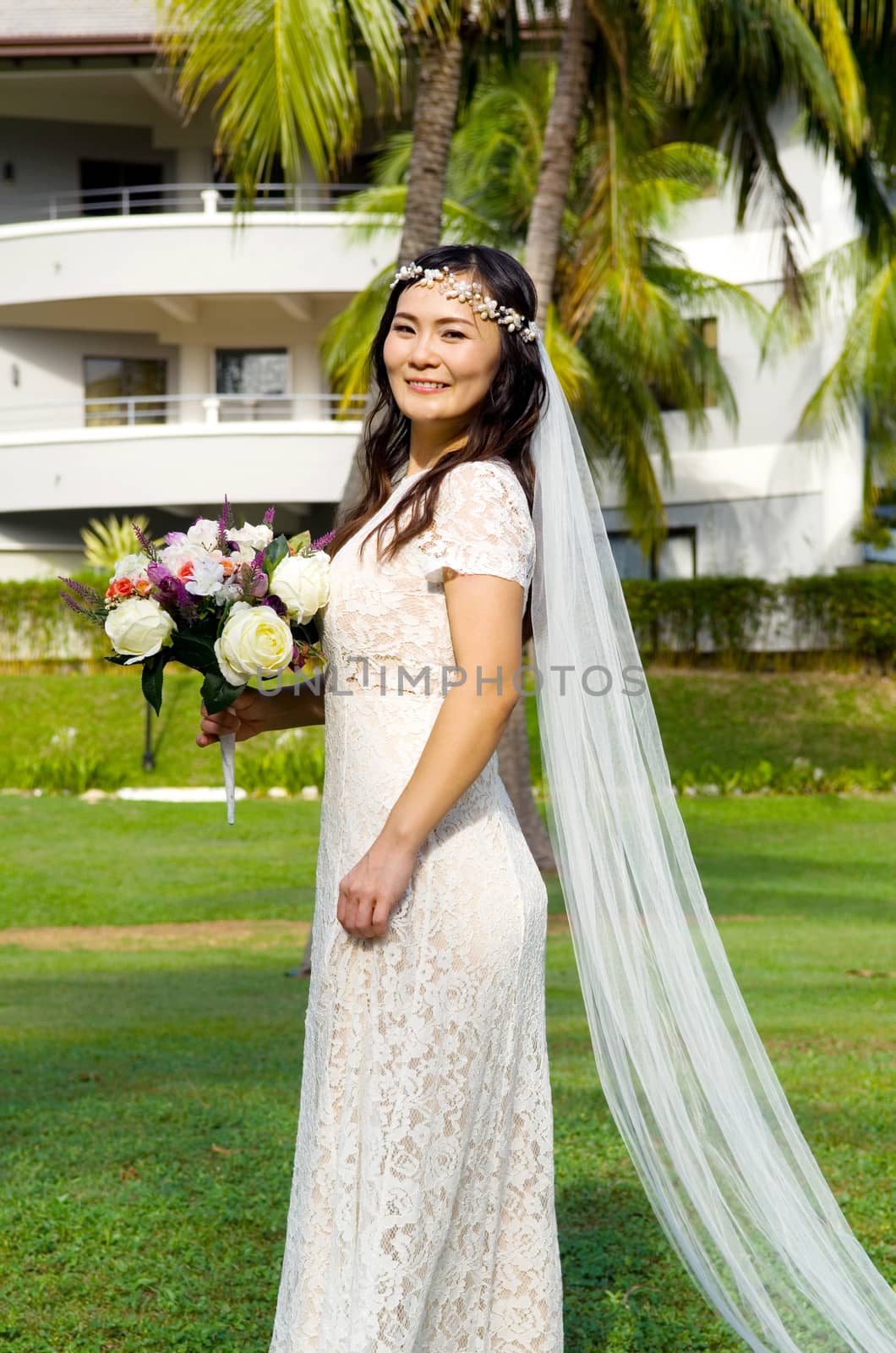 Asian bride at outdoor in a morning