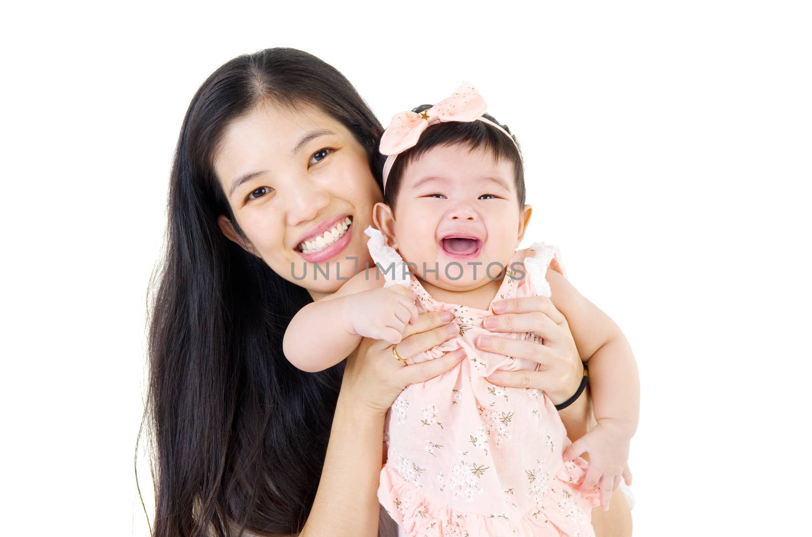 Asian mother playing with baby girl